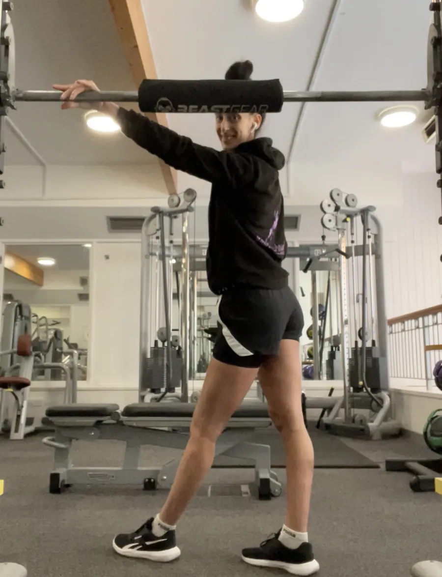 Nicola lifting a barbell in the gym